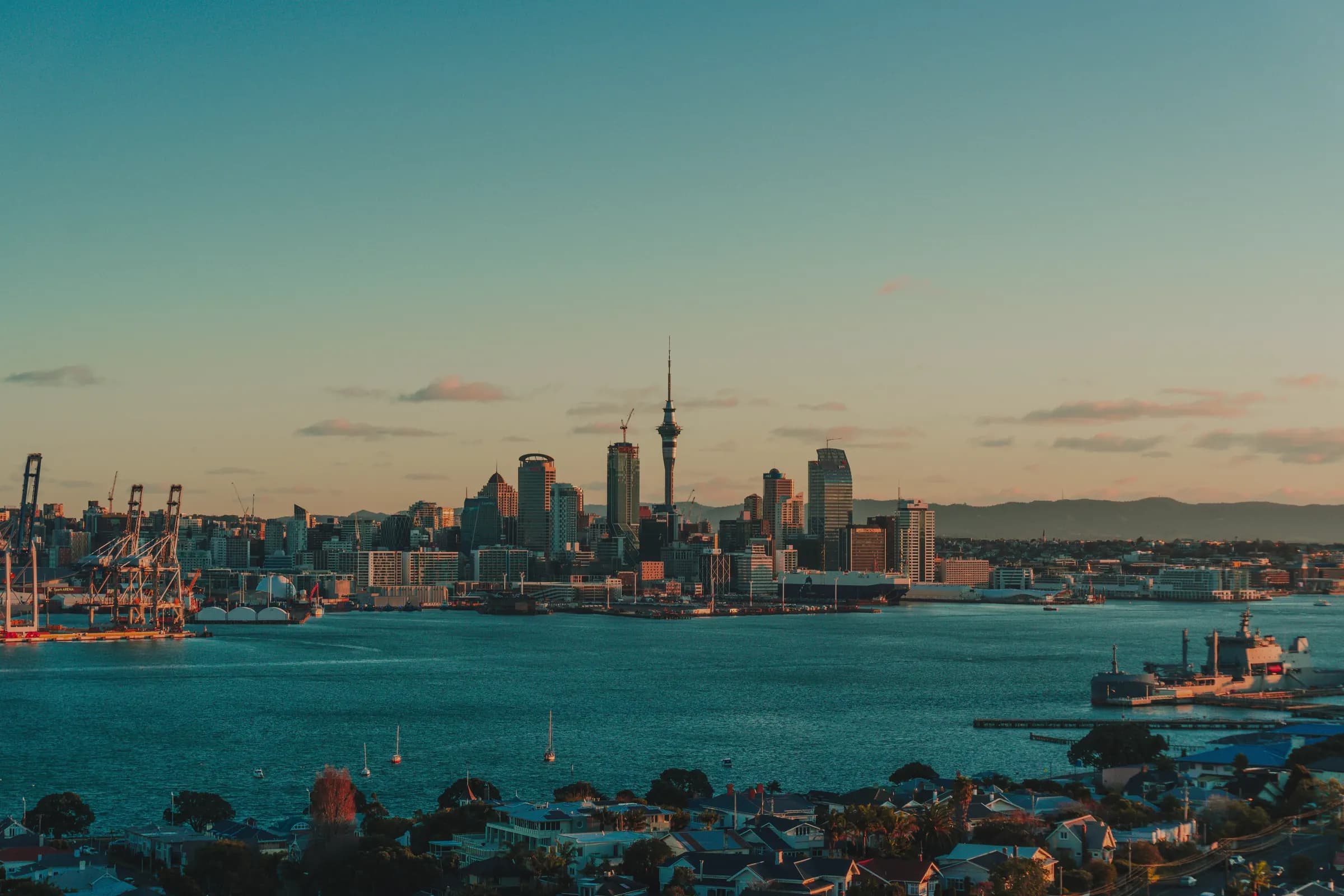 The Auckland city skyline at dusk across the Waitematā Harbour, New Zealand