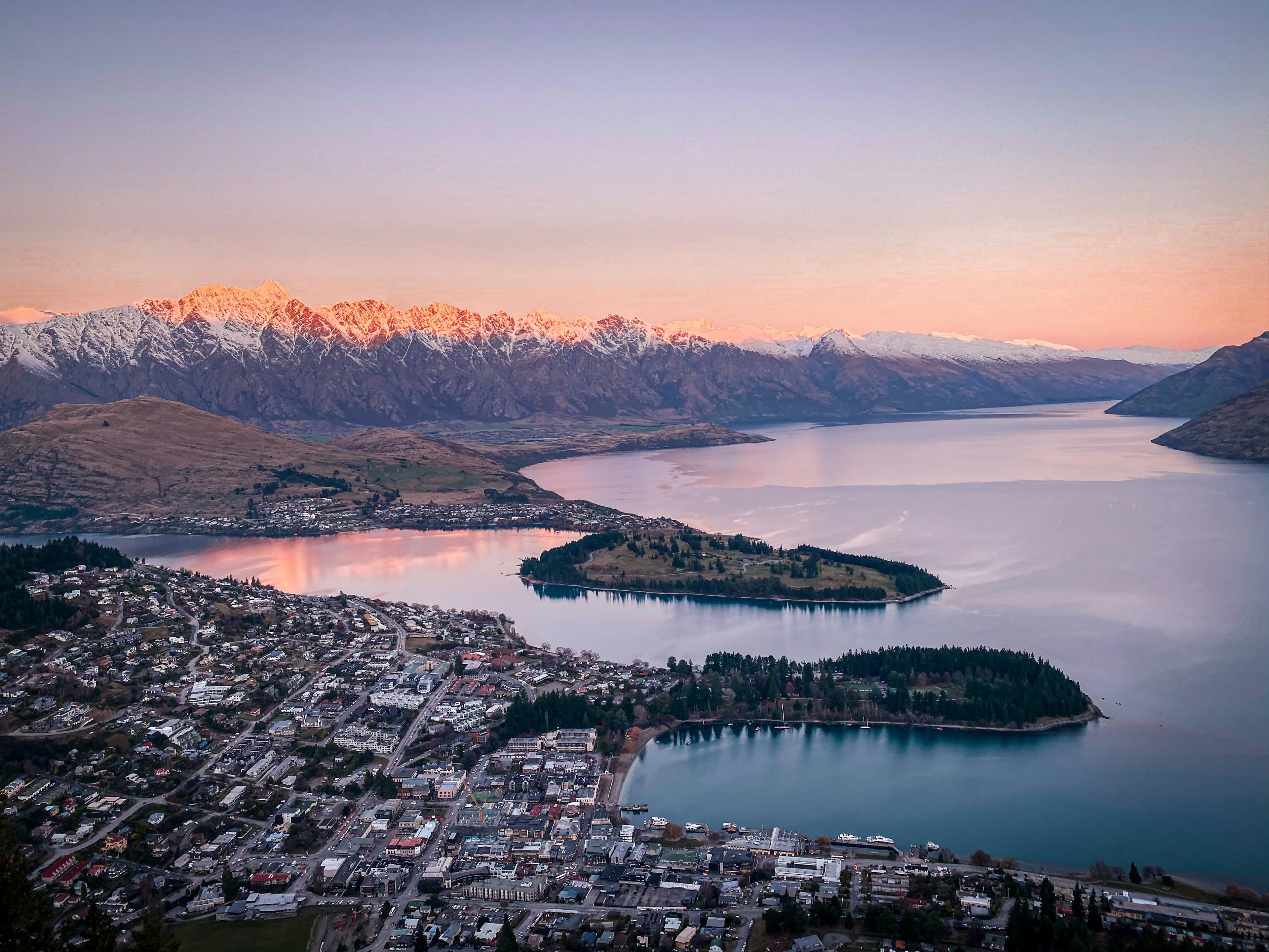 Queenstown and Lake Wakatipu at dusk, with the Remarkables catching the last light, New Zealand
